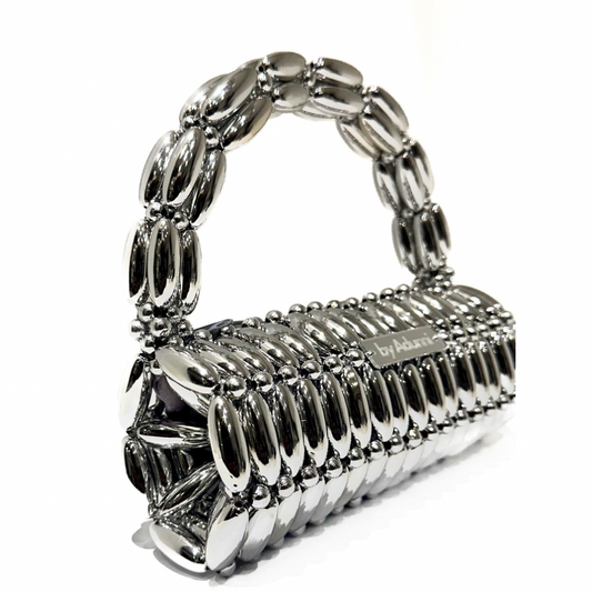 Side view of platinum barrel beaded bag