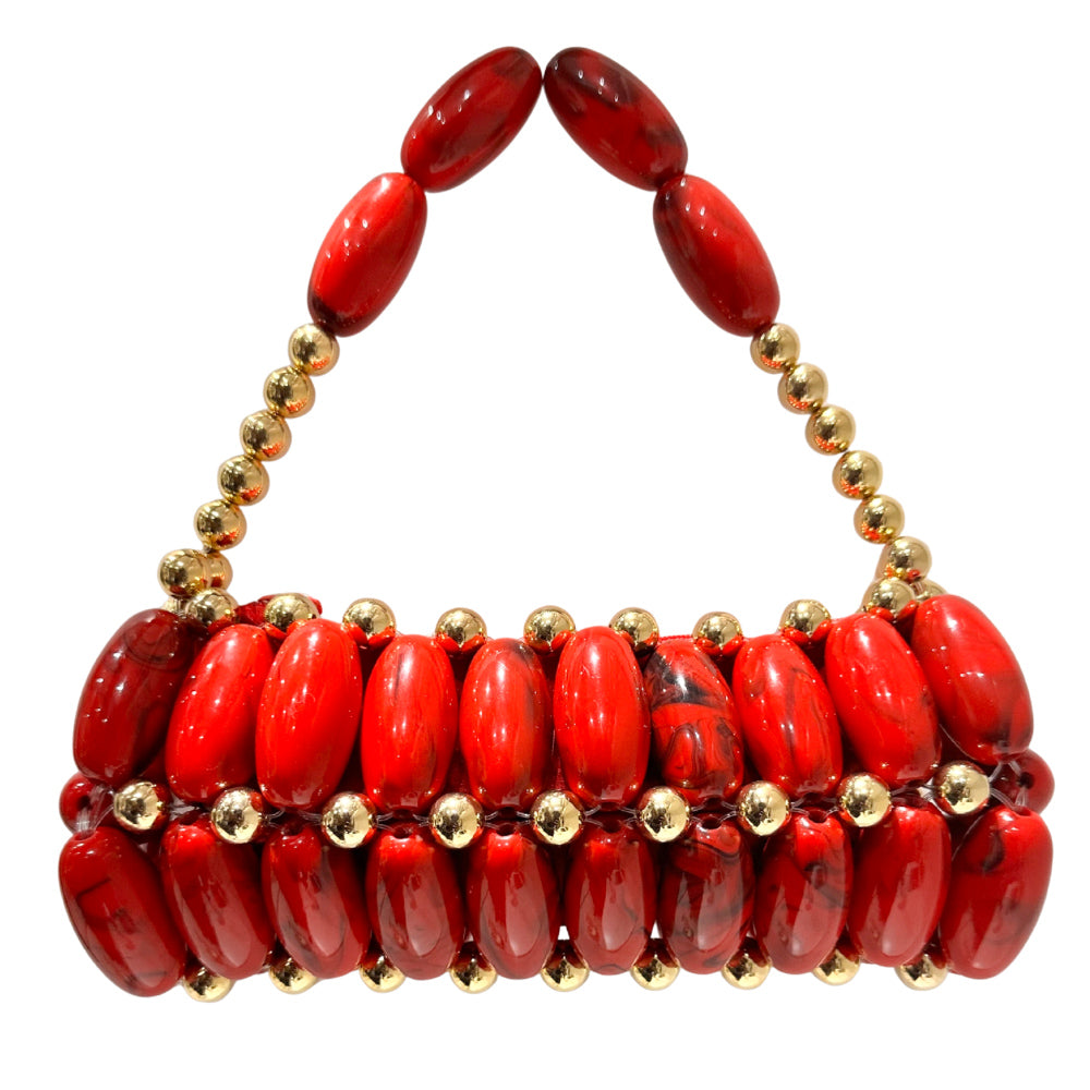 Red beaded clutch with gold accents on a white background