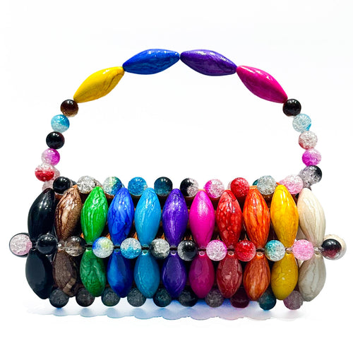 Colorful beaded handbag on a white background