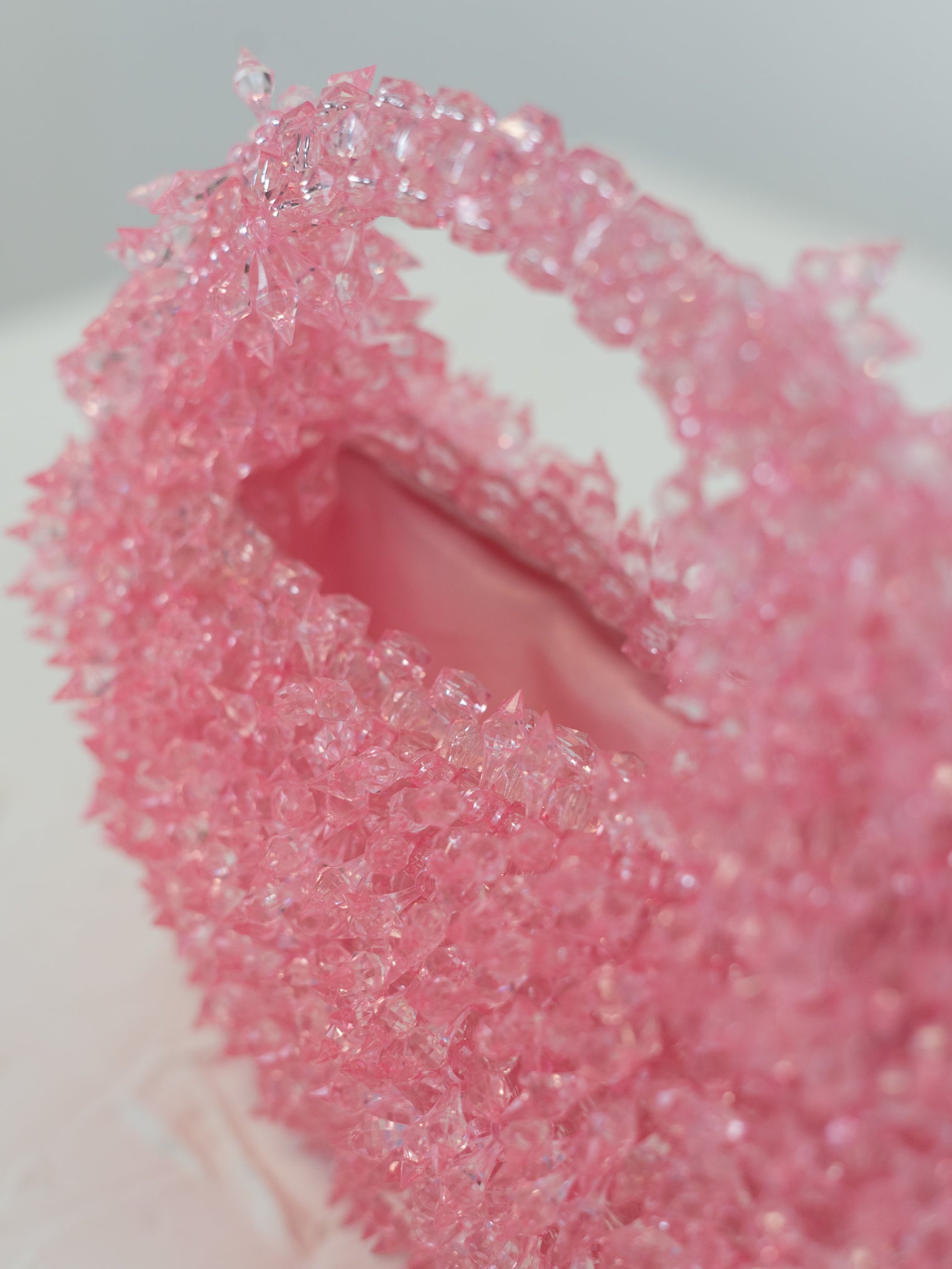 Close up of baby pink beaded bag
