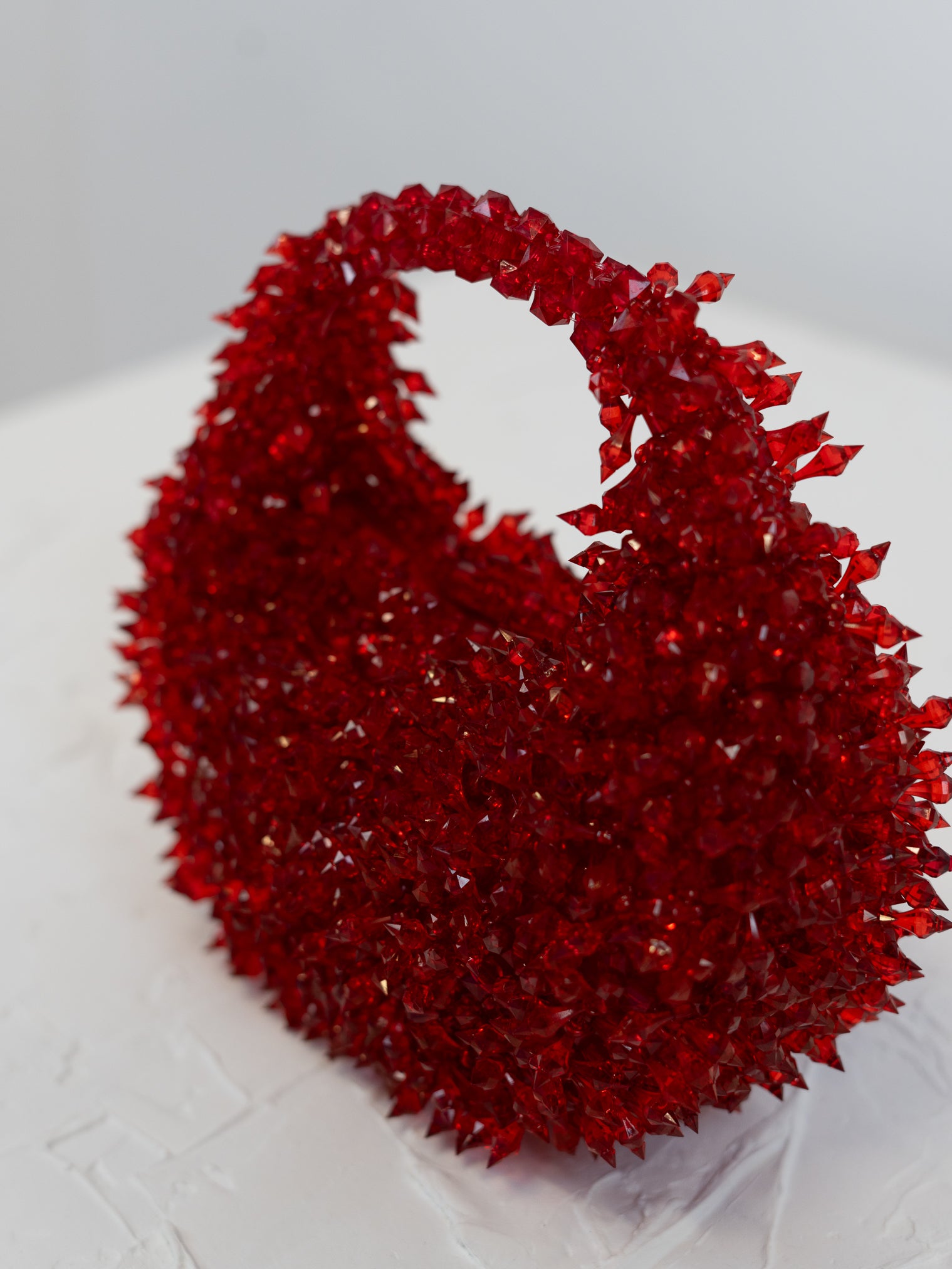 Close up of red spiked beaded bag