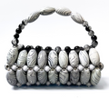 Close up of white zebra beaded bag with marble striped black tones and white beads