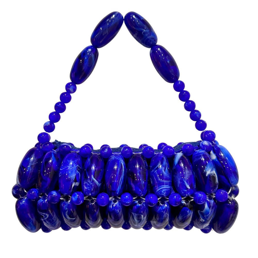 indigo blue marble beaded bag on white background