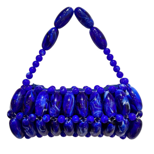 indigo blue marble beaded bag on white background