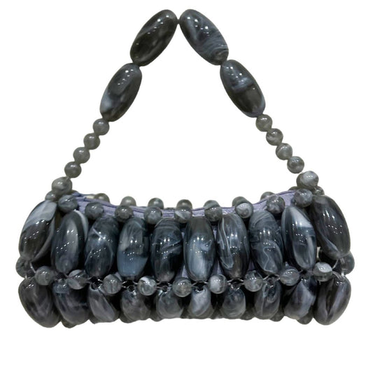 A handcrafted handbag made with handpicked beads in gray color.
