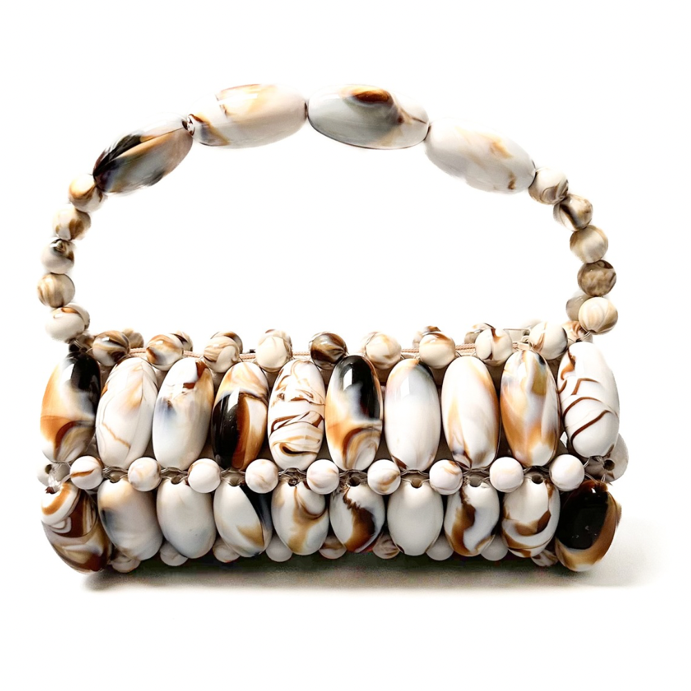 Close up of handmade beaded bag in cream marble- cream, white and brown tones