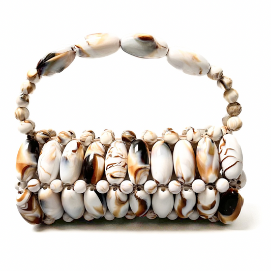 Close up of handmade beaded bag in cream marble- cream, white and brown tones
