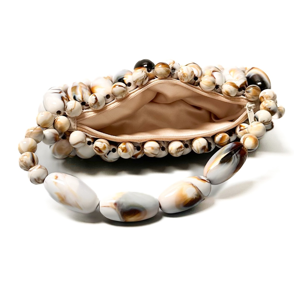 View of inside the cream marble beaded bag, part of the tortoise shell marble collection