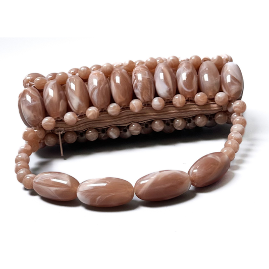 Neutral brown stone beaded bag laid down flat displaying the zip pouch 