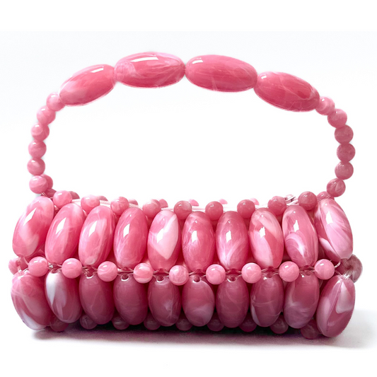 Close up of Fuchsia Pink Beaded bag with pink swirled marble tones