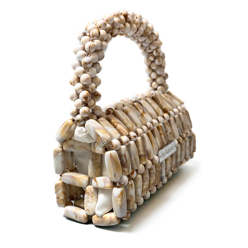 Close up of Cream Marble XL beaded bag showing helix handle detail