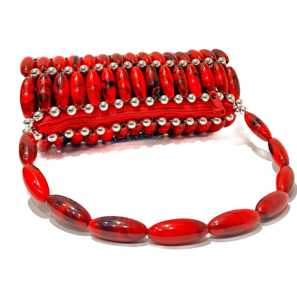 Red beaded handbag with silver accents on a white background laid flat showing the red zip pouch.