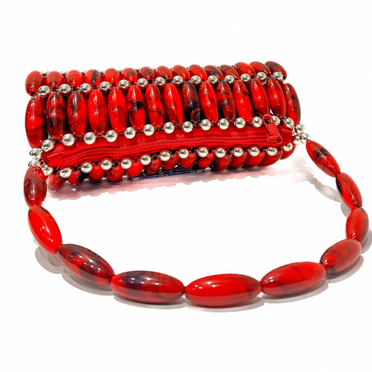 Red beaded handbag with silver accents on a white background laid flat showing the red zip pouch.