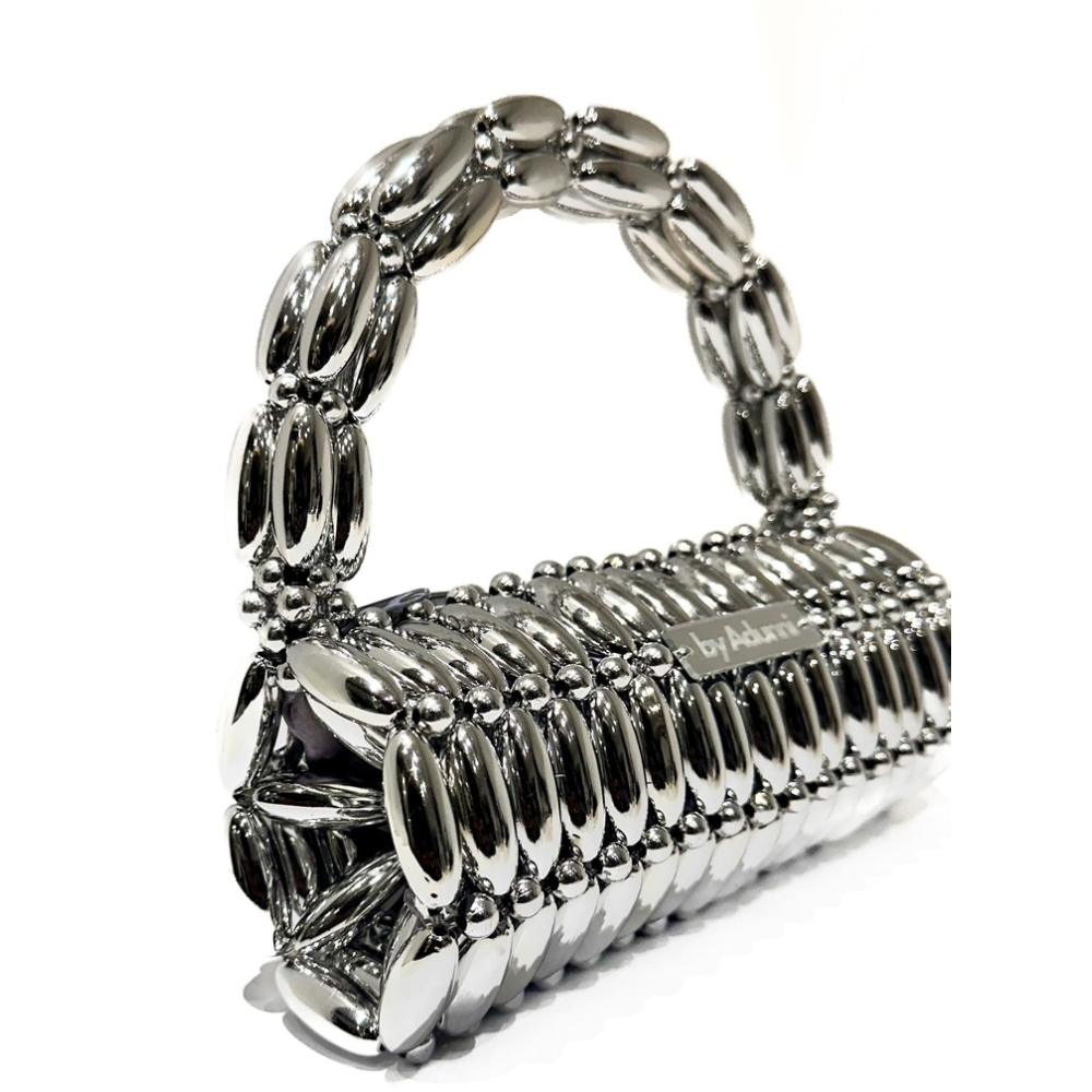 Side view of platinum barrel beaded bag