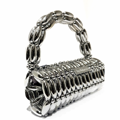 Side view of platinum barrel beaded bag