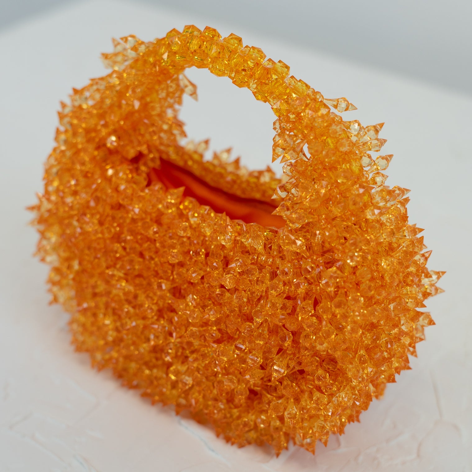 Inside spiked orange beaded bag