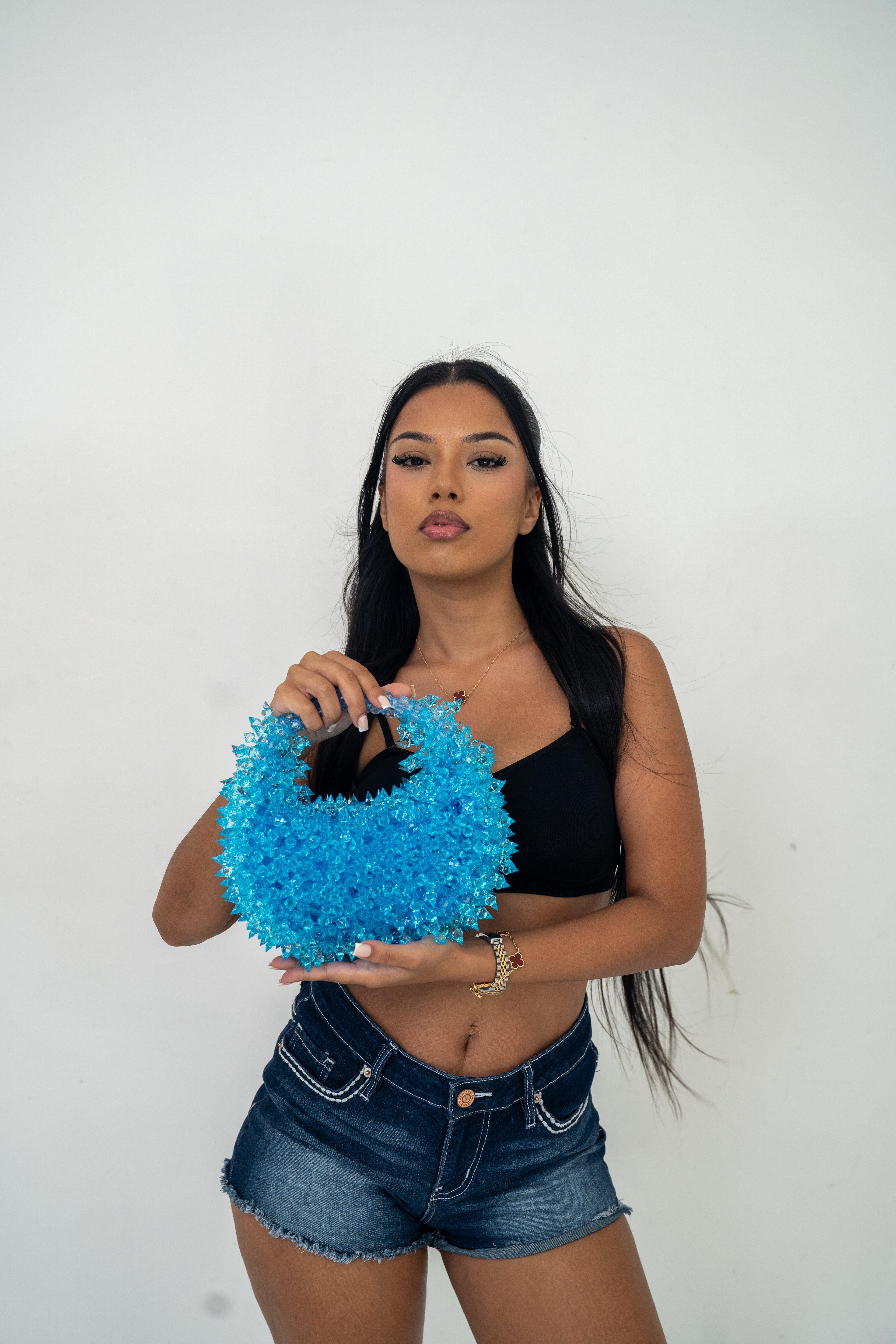model showcasing Spiky Baby Blue beaded bag