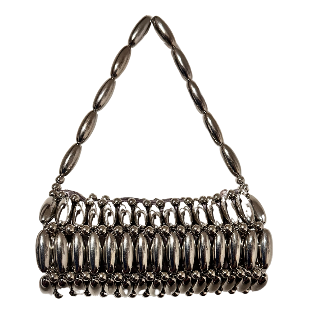 Silver handbag with beaded handle and base on a white background