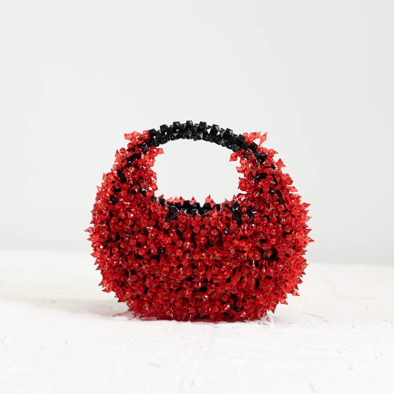 Spiky Rouge Noir handmade beaded bag with black base and red spikes